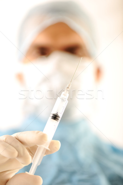 Doctor at hospital holding needle Stock photo © zurijeta