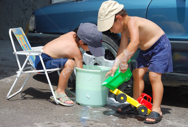 Child washing car and toy car Stock photo © zurijeta