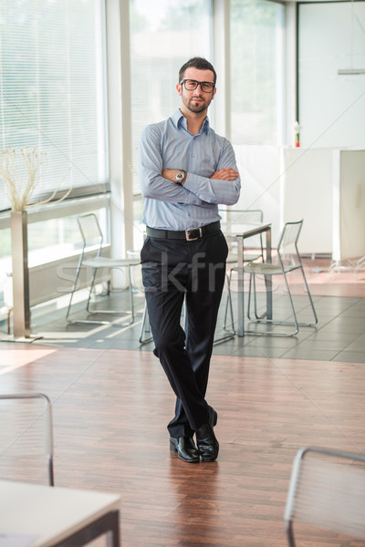 Business man posing in an office Stock photo © zurijeta