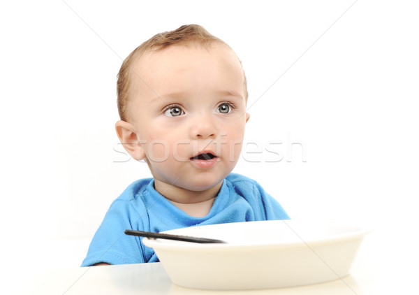 Aranyos imádnivaló egyéves baba zöld szemek eszik Stock fotó © zurijeta