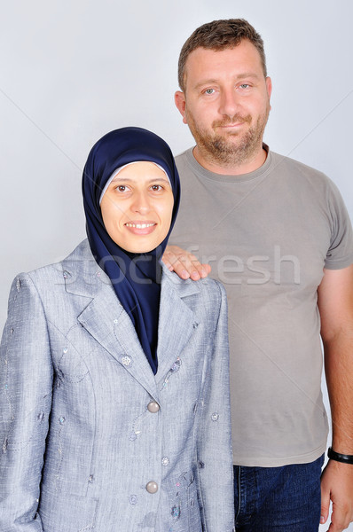 Young muslim couple, standing, isolated, studio Stock photo © zurijeta