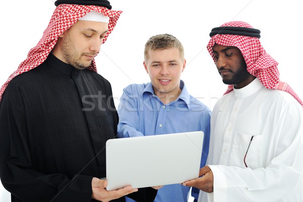 A business team of three planning work in office Stock photo © zurijeta