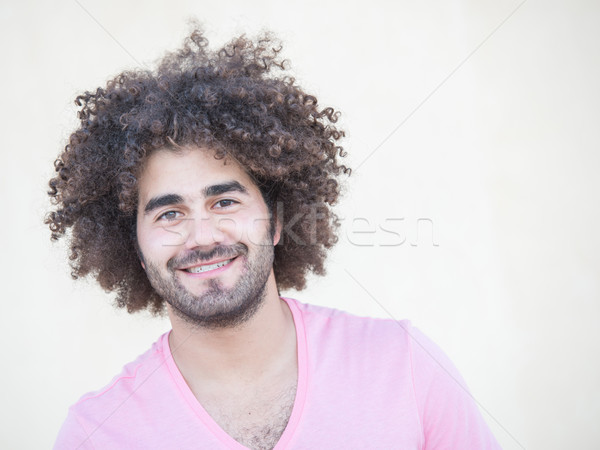 Portrait Of Young Attractive Guy With Long Curly Hair Stock