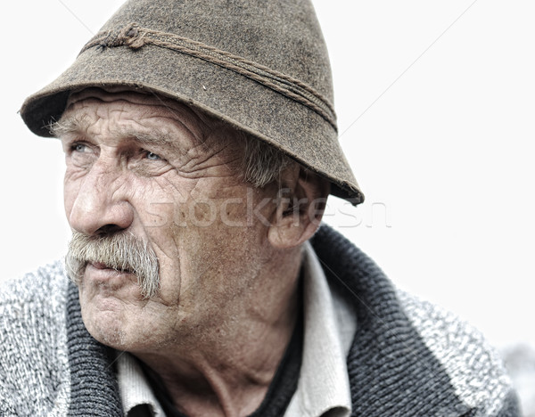 Elderly man's face over white background Stock photo © zurijeta