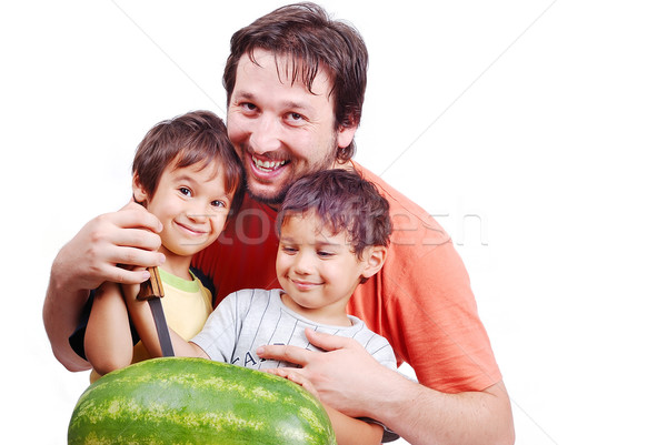Happy father and two kids preparing watermelon Stock photo © zurijeta