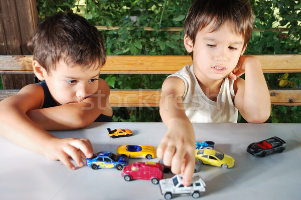 Children playing with cars toys outdoor in summer time Stock photo © zurijeta