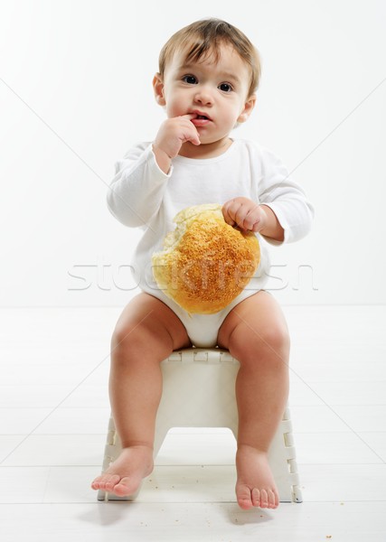 Baby eating bun bread Stock photo © zurijeta