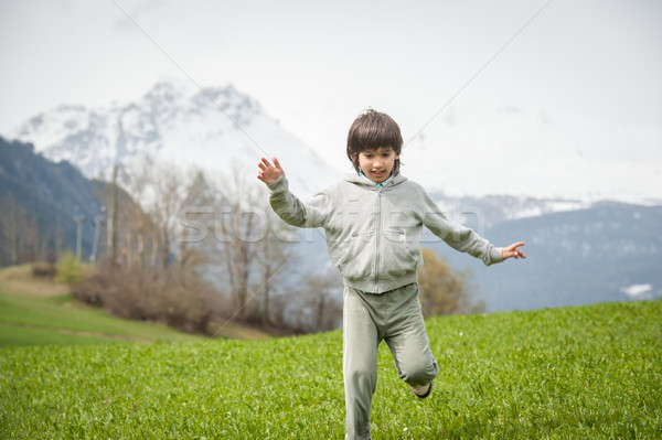 Fiú gyönyörű hegy legelő gyermek mező Stock fotó © zurijeta