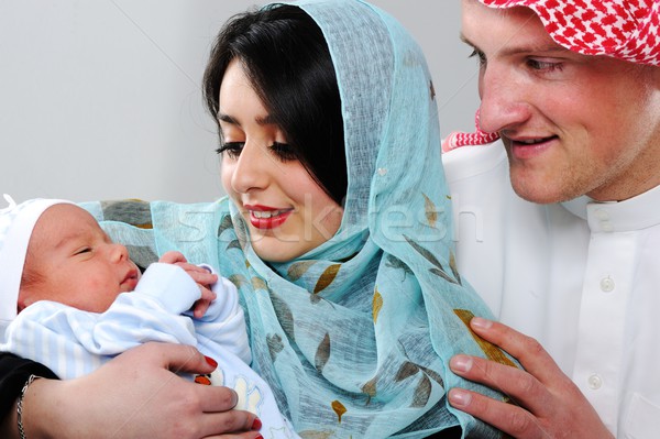 Arabic Muslim couple with new baby at home Stock photo © zurijeta