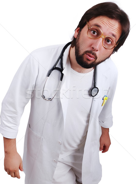 Young male doctor in white standing close up with funny surprised face Stock photo © zurijeta