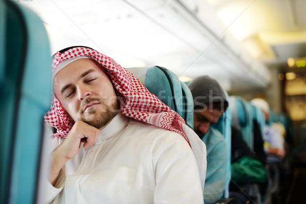 Modern Arabic businessman inside airplane Stock photo © zurijeta