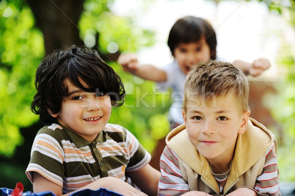 Happy children enjoying childhood on trampoline Stock photo © zurijeta