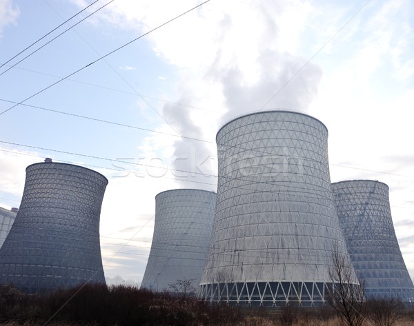 Coal fired power station with cooling towers releasing steam int Stock photo © zurijeta