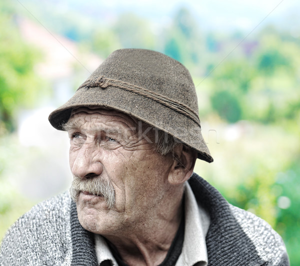 Elderly man's face over white background Stock photo © zurijeta