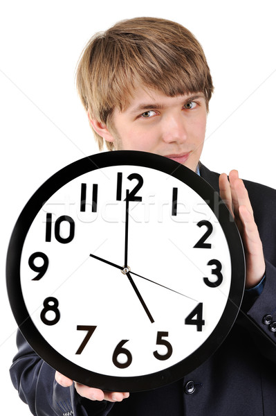 Handsome teenage guy holding clock in his hands Stock photo © zurijeta