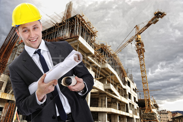 Stock photo: engineer builder with  blueprint at construction site