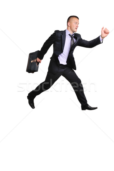 Full length portrait of a businessman running away against white background Stock photo © zurijeta
