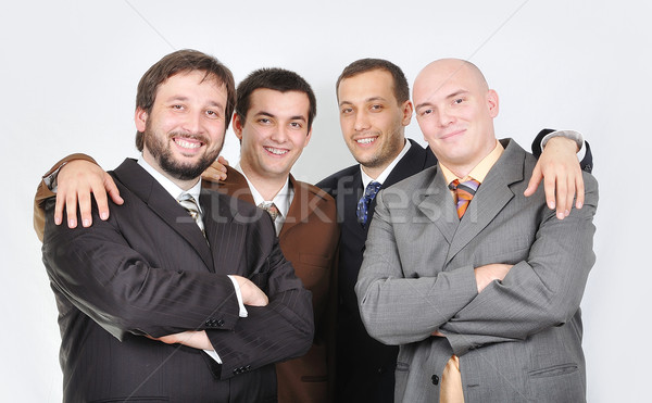 Group of young businessmen together on light background Stock photo © zurijeta