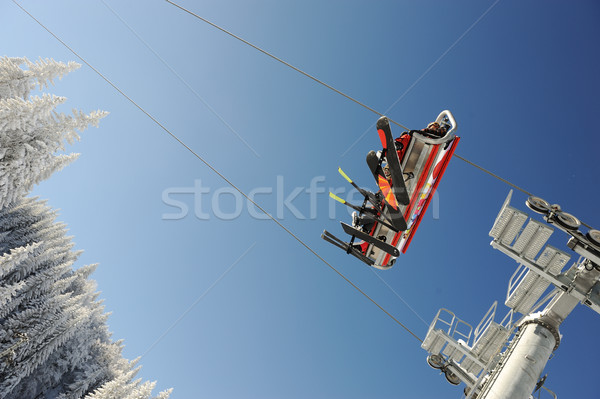 Sky sky lift carrying skiers. Stock photo © zurijeta