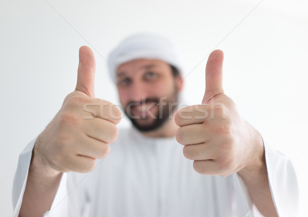 Arabic man wearing traditional clothes with thumb up Stock photo © zurijeta