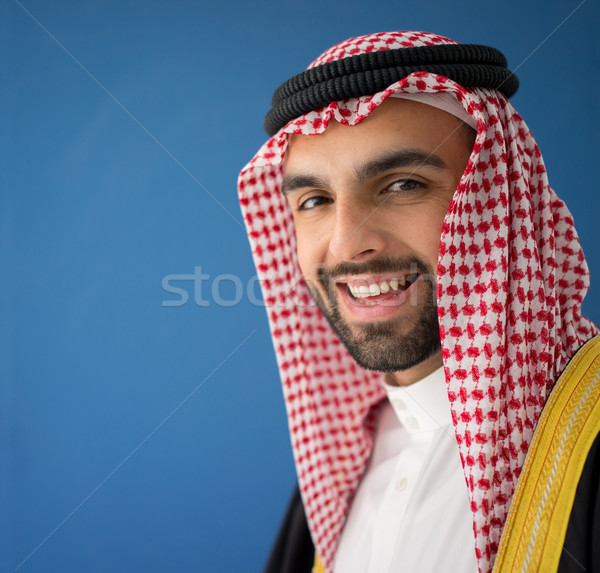 Portrait of attractive Arab man with sheikh robe Stock photo © zurijeta