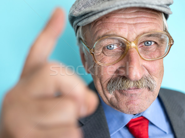 Portrait of a smiling and confident mature businessman with must Stock photo © zurijeta