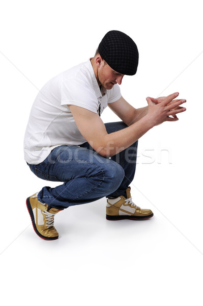 Young man crouching Stock photo © zurijeta