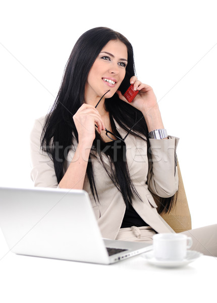 View of beautiful business woman holding cell phone and speaking on Stock photo © zurijeta