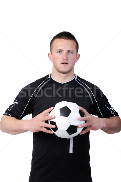 Soccer player holding a football isolated on white background Stock photo © zurijeta