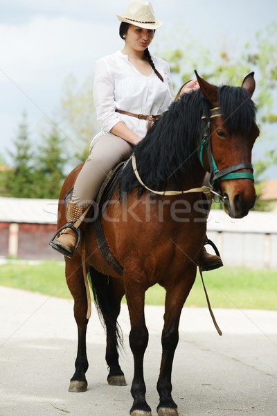 Bild glücklich weiblichen Sitzung Pferd Dorf Stock foto © zurijeta