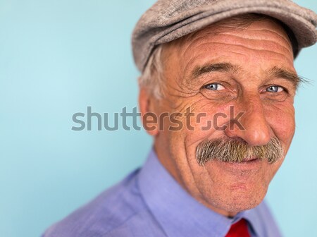 Portrait of a smiling and confident mature businessman with must Stock photo © zurijeta