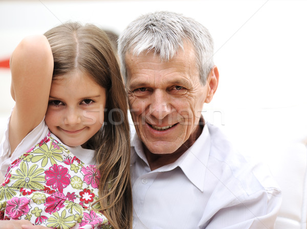 Gyereknevelés idős férfi kicsi lánygyermek portré Stock fotó © zurijeta