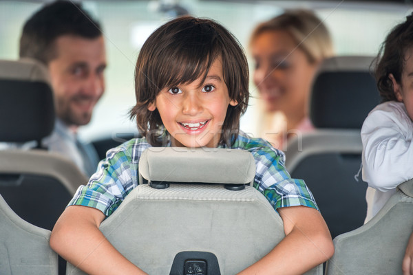 Smiling boy in the car backseat Stock photo © zurijeta