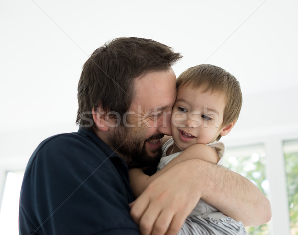 Father and baby boy at home enjoying love Stock photo © zurijeta