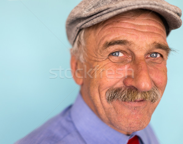 Portrait of a smiling and confident mature businessman with must Stock photo © zurijeta