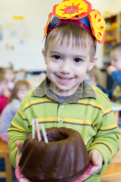 Stock photo: Little cute boy having birthday party at kindergarden