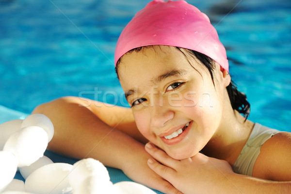 Kicsi gyerek lány úszómedence mosoly boldog Stock fotó © zurijeta