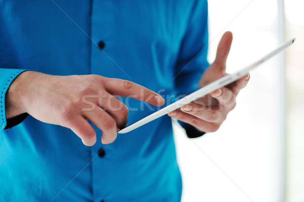 Closeup of a man holding ipad Stock photo © zurijeta
