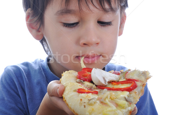 Cute little boy eating pizza, isolated Stock photo © zurijeta