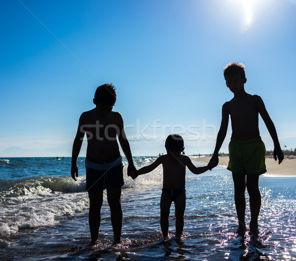 Fun kids playing splash at beach Stock photo © zurijeta