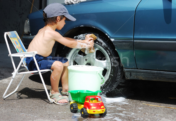 Playing around the car and cleaning, children in summertime Stock photo © zurijeta