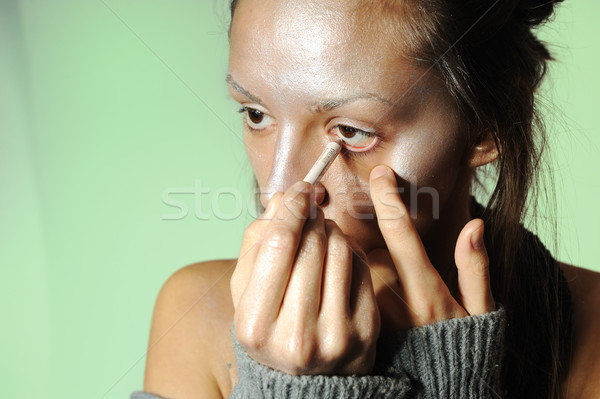 Beautiful woman putting mascara on her eyes - make up concepts Stock photo © zurijeta