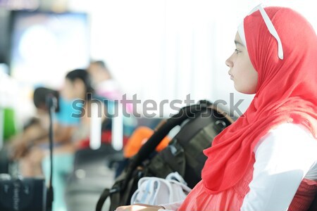 Stock photo: Arabic Middle eastern teenage girl traveling, airport transit