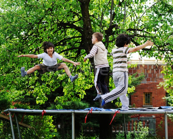 Glücklich Kinder genießen Kindheit Trampolin heiter Stock foto © zurijeta