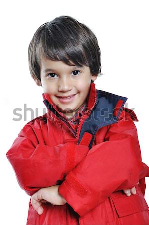 Kid with red jacket on white background Stock photo © zurijeta