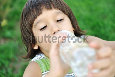 Child drinking pure water in nature Stock photo © zurijeta