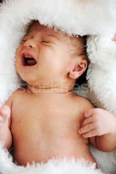 Recién nacido bebé sonrisa nino naranja cama Foto stock © zurijeta