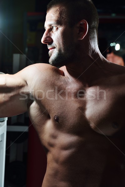 Athletic bodybuilder, execute exercise in sport gym hall Stock photo © zurijeta