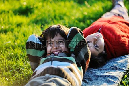 Happy kid enjoying sunny late summer and autumn day in nature on Stock photo © zurijeta