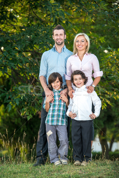 Parents posing with two kids Stock photo © zurijeta